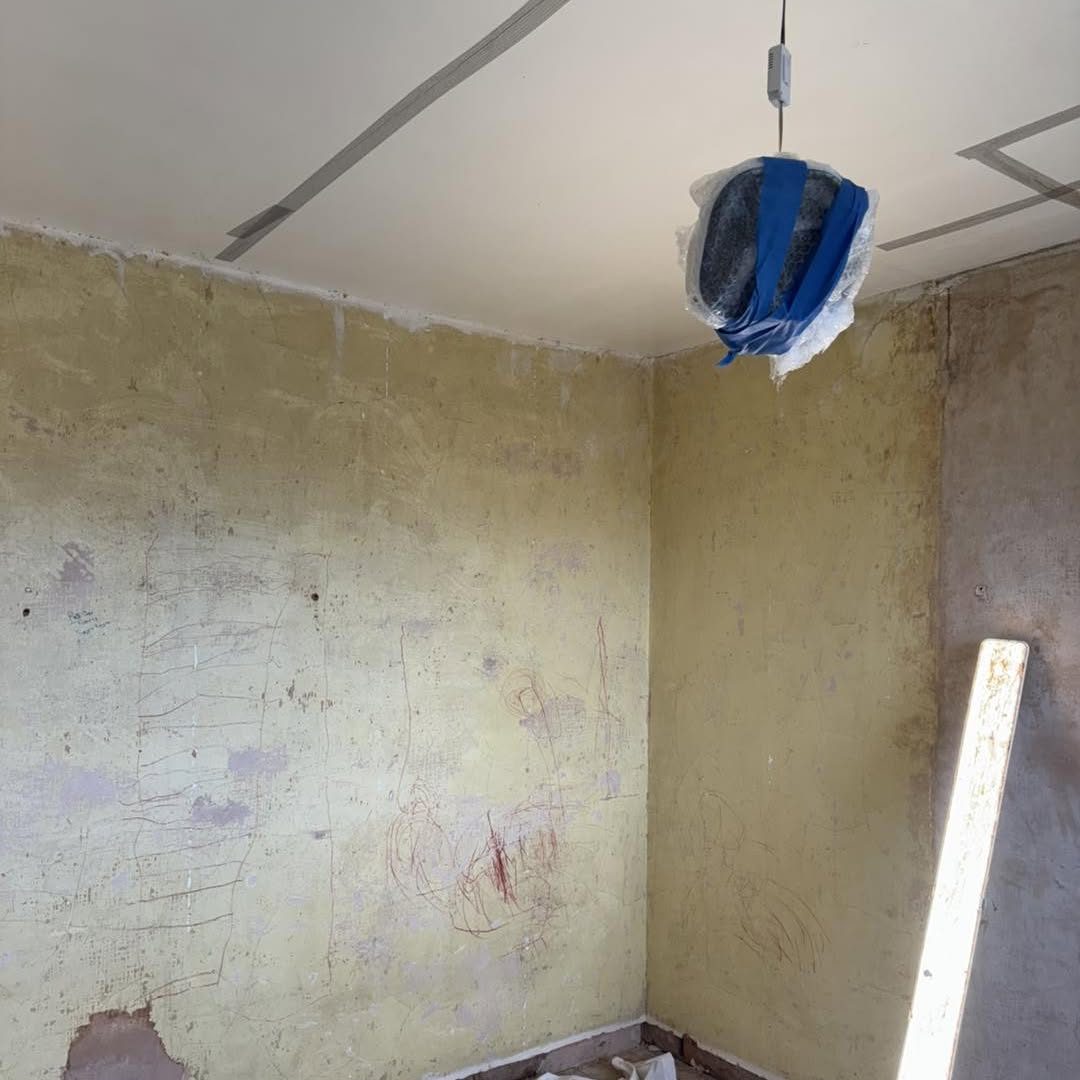 Before: old walls stripped back, Hughes Plastering Services