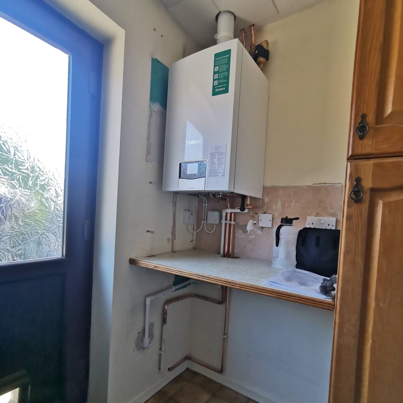 After: new combi in the same corner, McCaffrey Plumbing & Heating