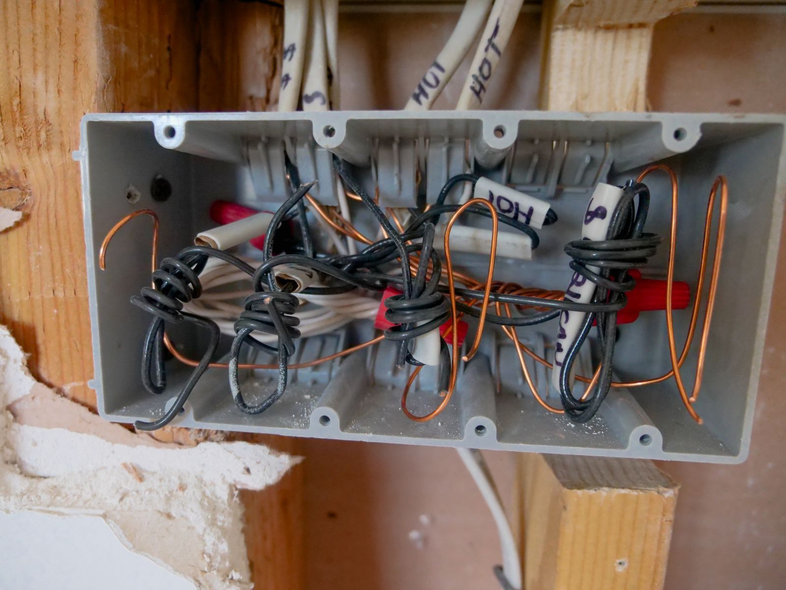 Open junction box with terminated conductors